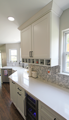  White Cabinet Herringbone Tile Backsplash Quartz Countertop Hardwood Floor Kitchen Remodel dRemodeling